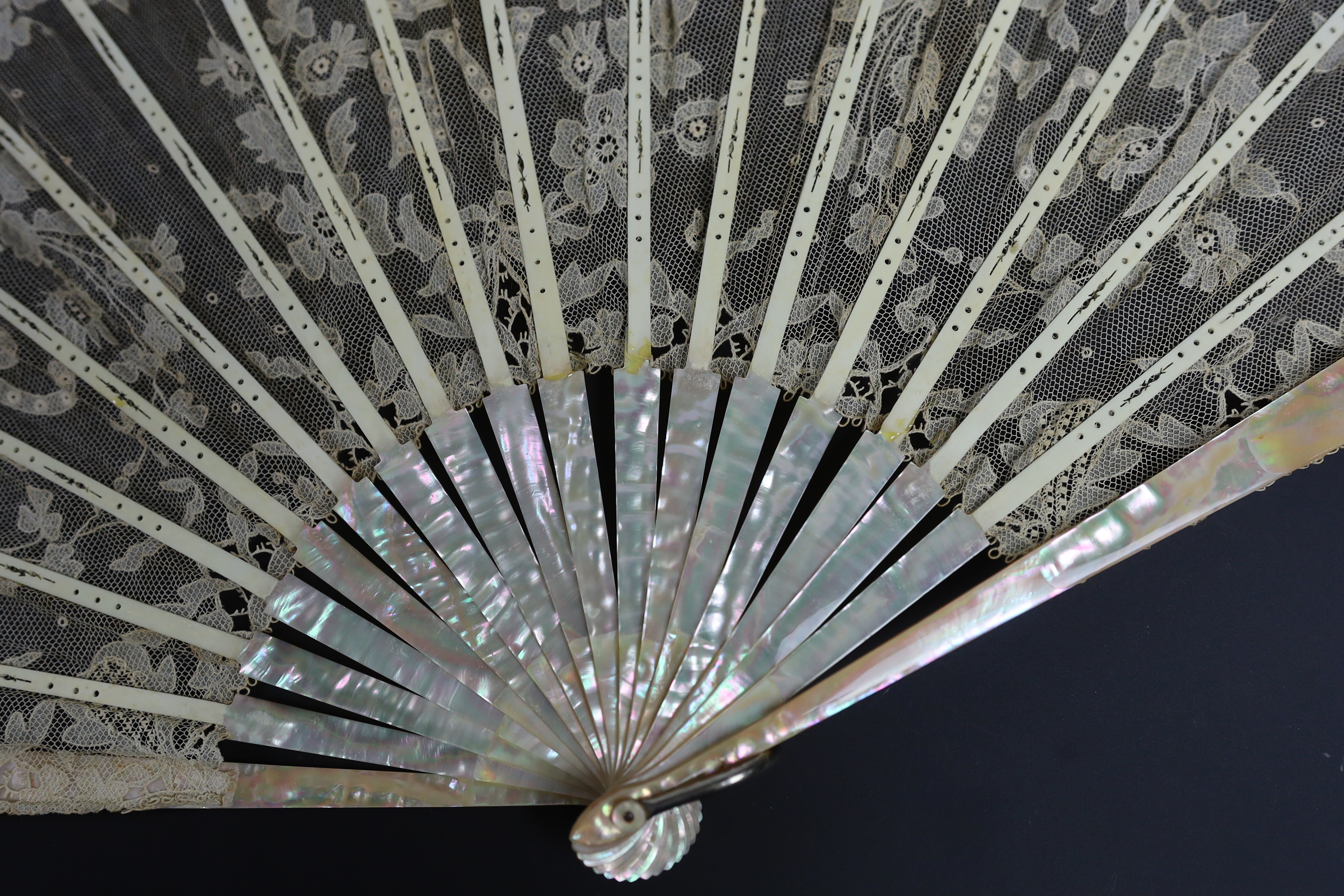 An unusual commemorative Carrickmacross lace fan, possibly one made and entered for a group of competitions held by the Worshipful Company of Fan Makers, the winning fan to be presented to Queen Victoria as a gift for he